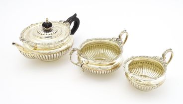 A Victorian silver three piece tea set comprising teapot, sugar bowl and milk jug, hallmarked London