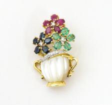 A 14ct gold brooch formed as a vase of flowers set with sapphires, rubies , emeralds and diamonds. 1