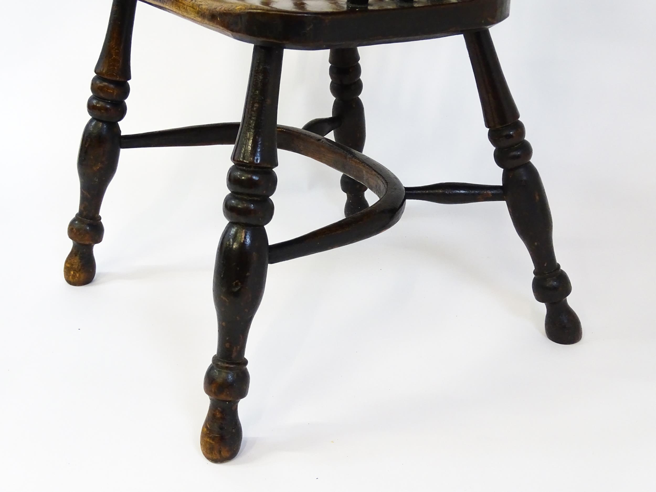 A mid 19thC ash and elm Windsor chair with a double bowed backrest and a pierced back splat above - Image 8 of 9