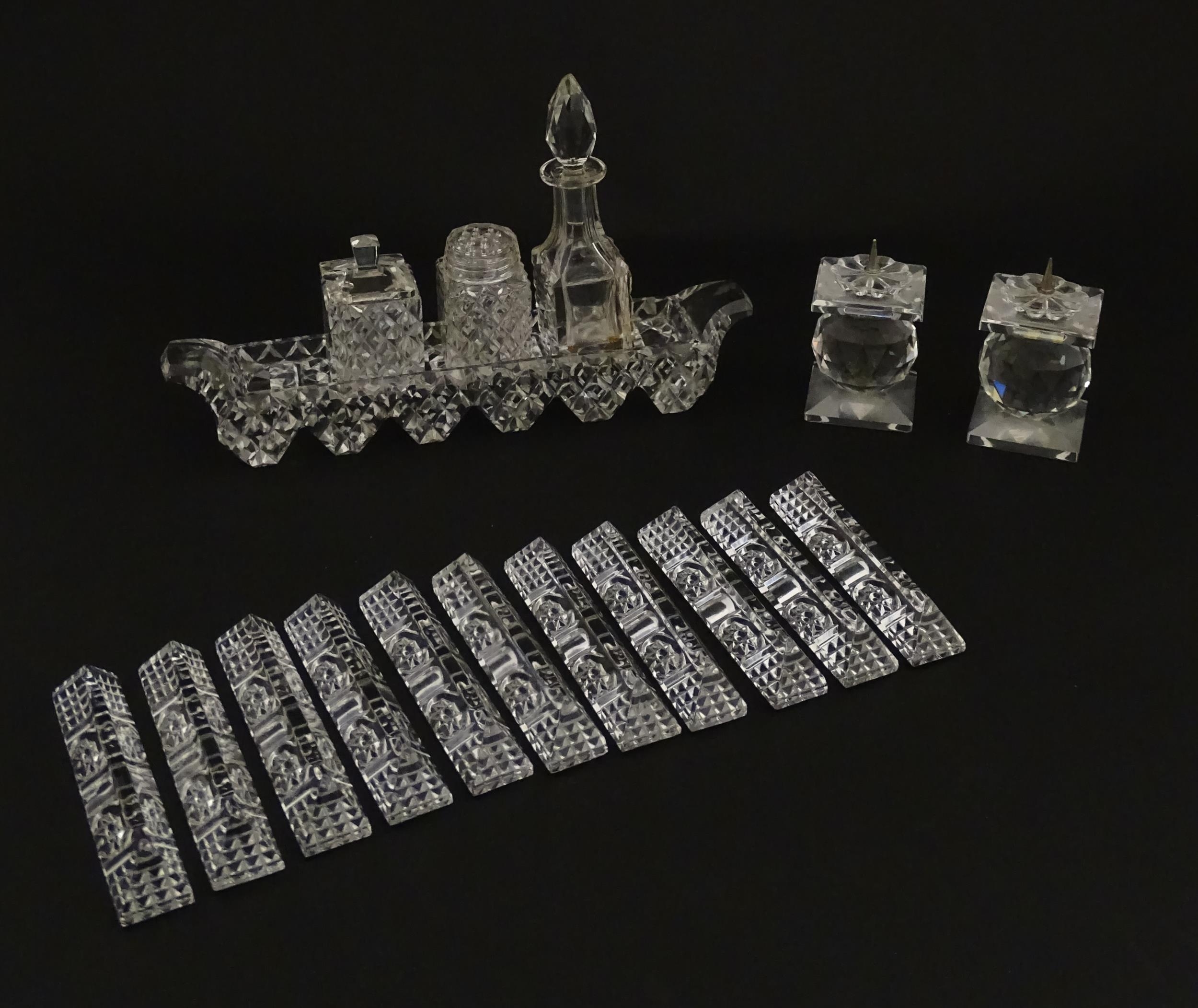 Assorted glass items to include eleven knife rests, cruet, and candle stands of pricket form by - Image 3 of 15