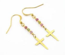 A pair of yellow metal drop earring with cross detail and coloured stones. Approx 2" long Please