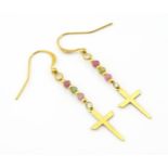 A pair of yellow metal drop earring with cross detail and coloured stones. Approx 2" long Please