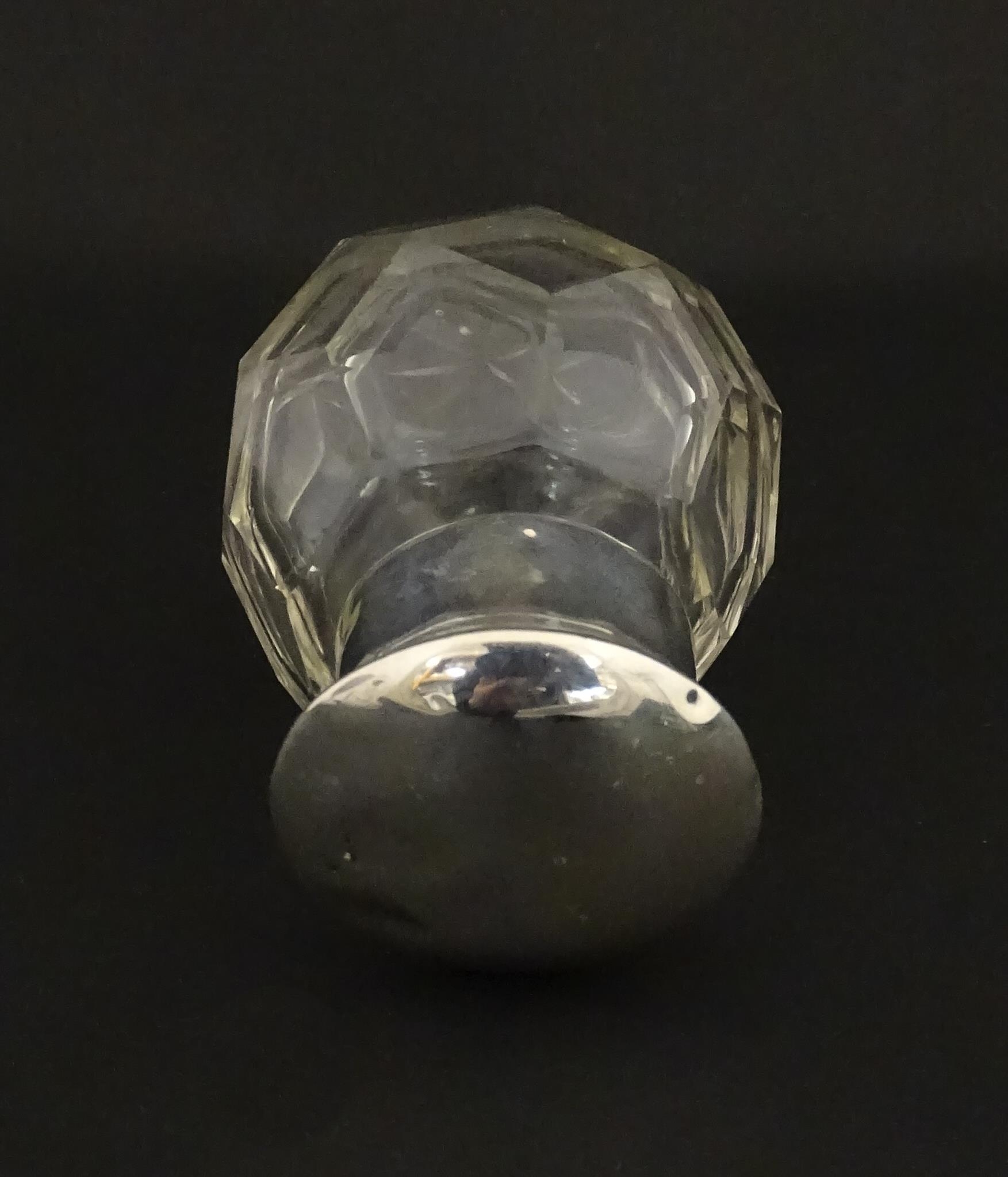 A cut glass scent / perfume bottle with silver top hallmarked Chester 1912. Approx. 2 3/4" high - Image 7 of 8