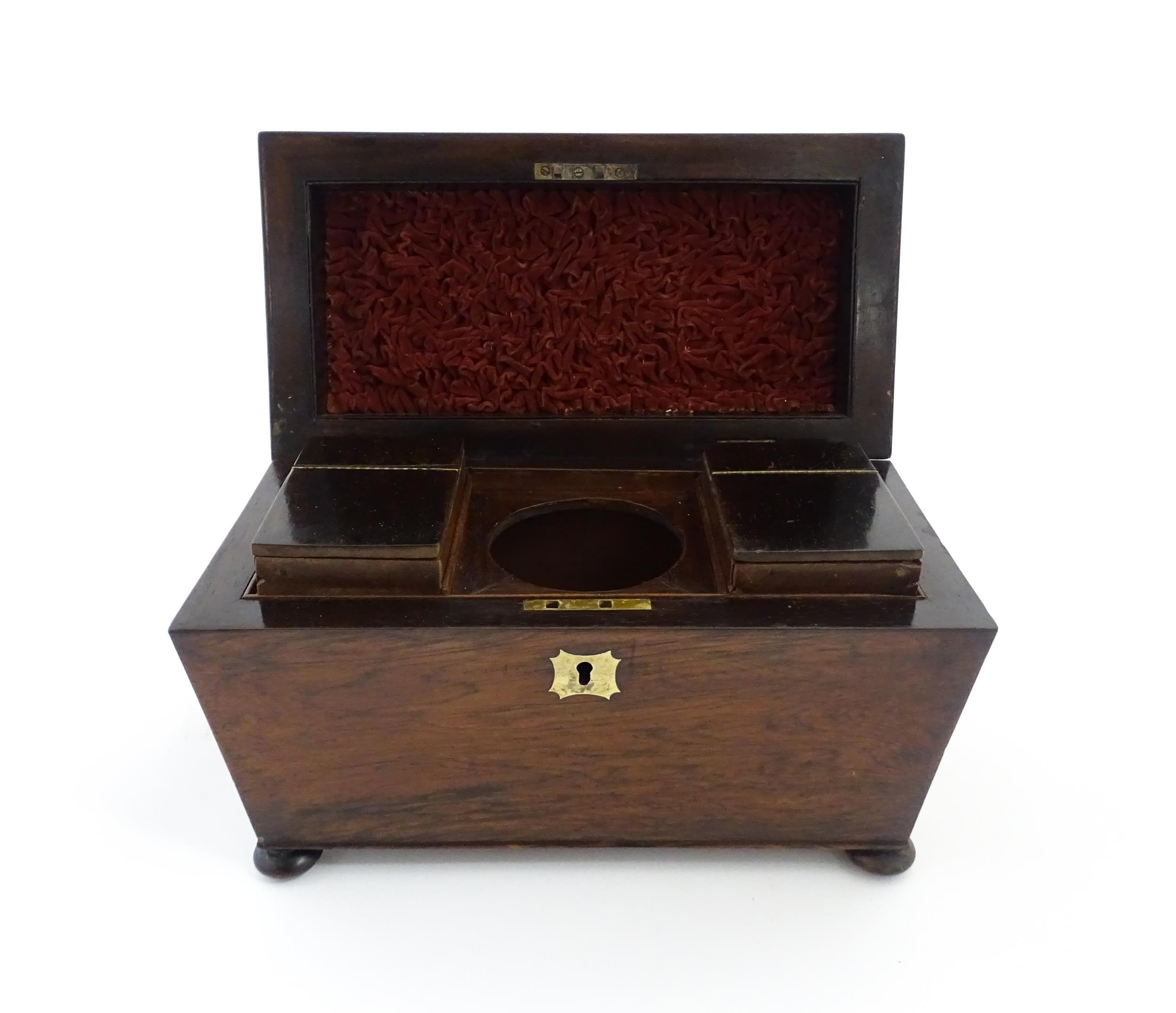 A 19thC rosewood tea caddy of sarcophagus form with four squat bun feet. The interior with two - Image 9 of 15
