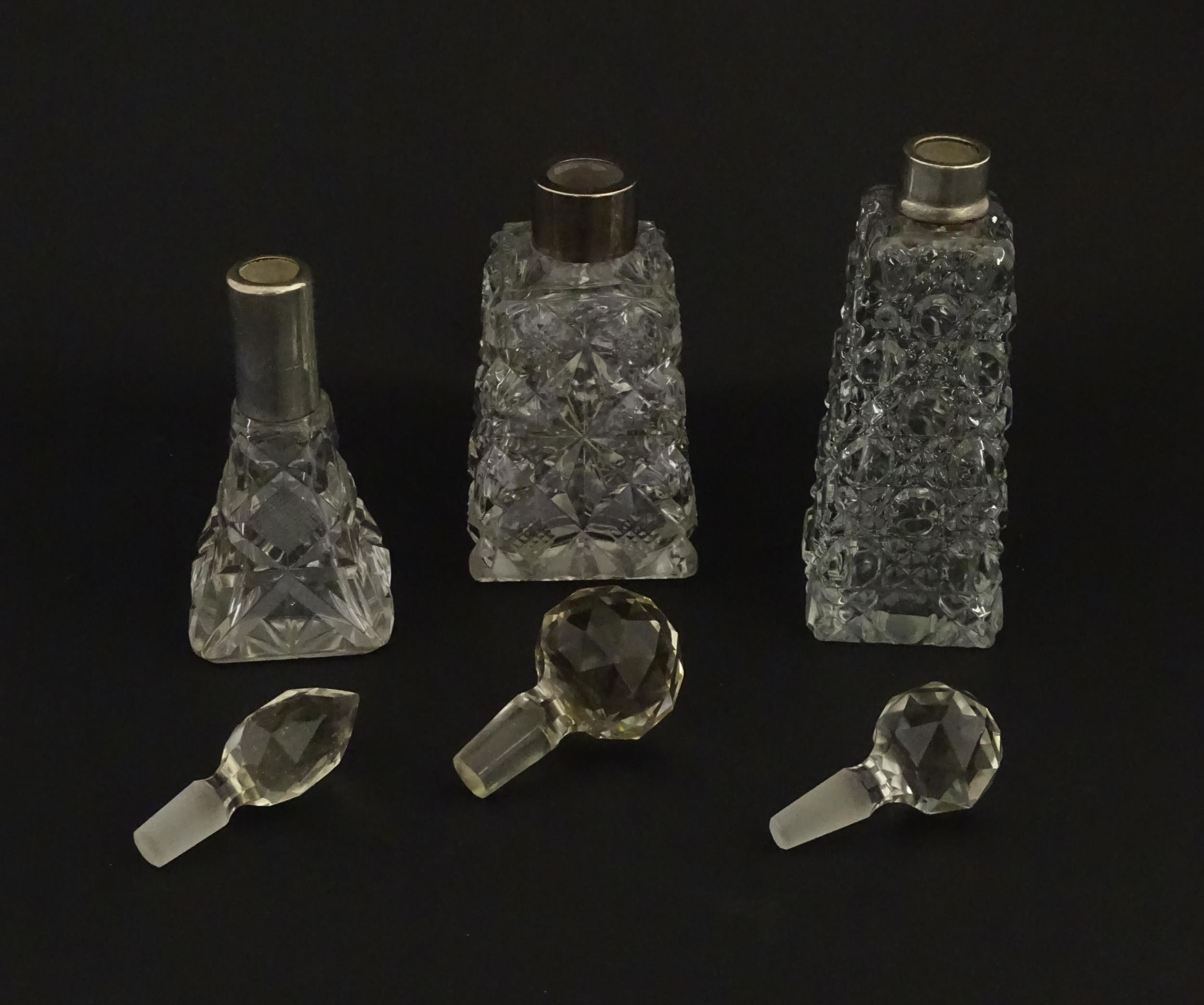Three assorted cut glass scent / perfume bottles with silver mounts, to include one hallmarked - Image 4 of 10