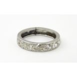 A diamond half eternity ring set with 7 diamonds. Ring size approx. L Please Note - we do not make