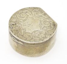 A Victorian silver pill box with engraved acanthus scroll decoration, hallmarked Birmingham 1896,