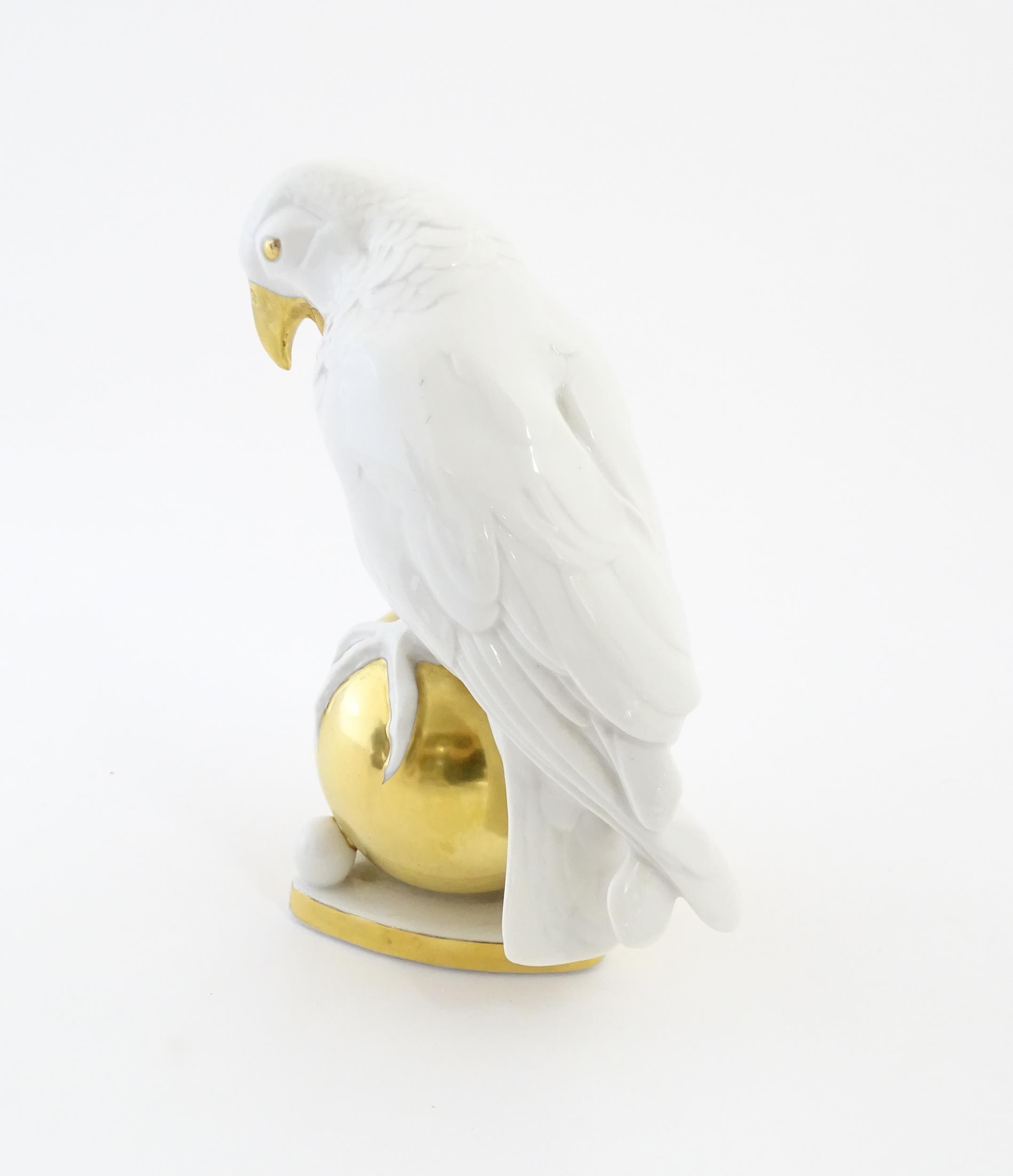 A Hutschenreuther model of a parrot perched upon a gilt ball. Marked under. Approx. 8 1/4" high - Image 5 of 8
