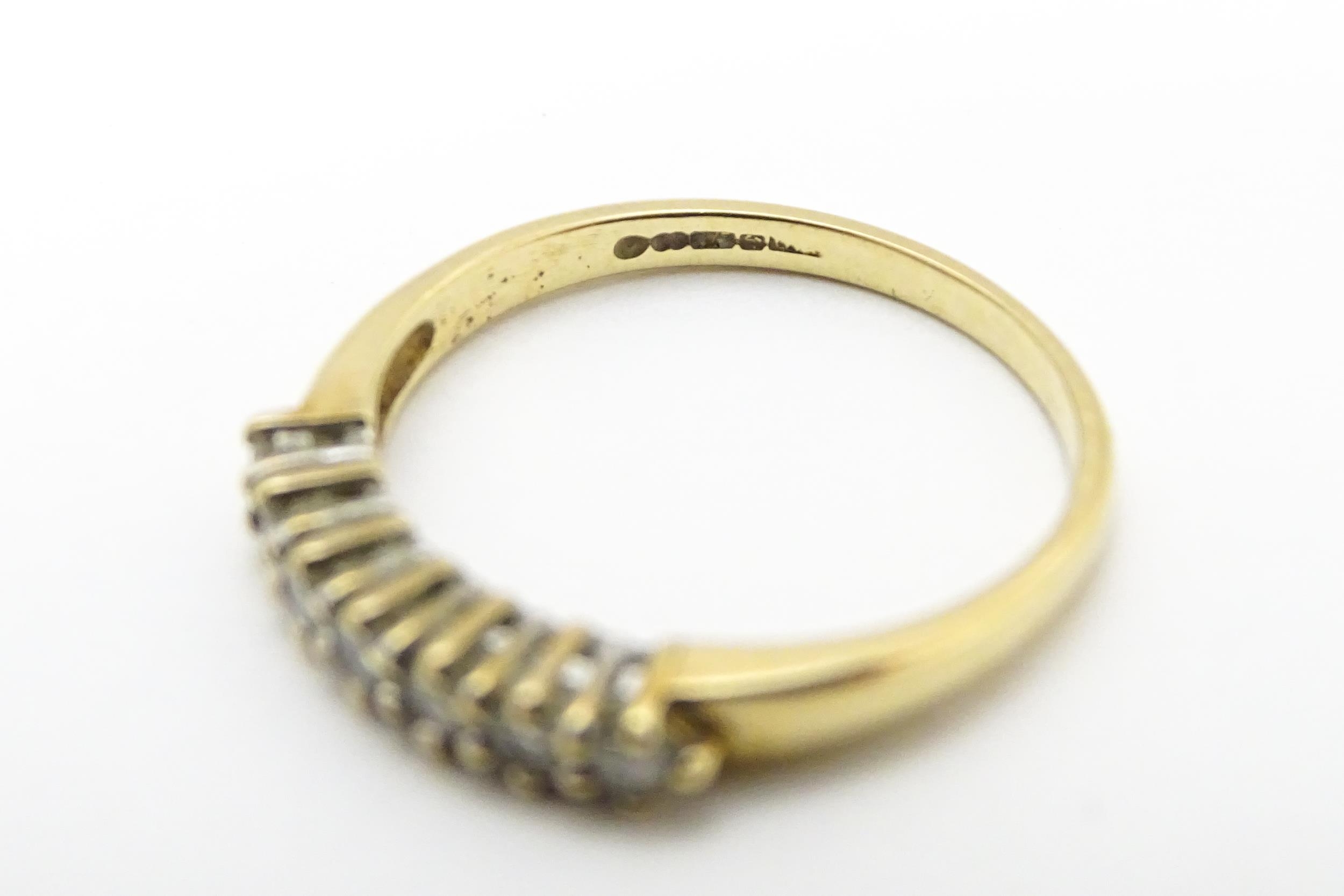 A 9ct gold ring set with seven diamonds in a linear setting. Ring size approx. K 1/2 Please Note - - Image 7 of 7