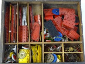 Toys: A quantity of assorted Meccano parts to include flat plates, girders, wheels, and tools Please