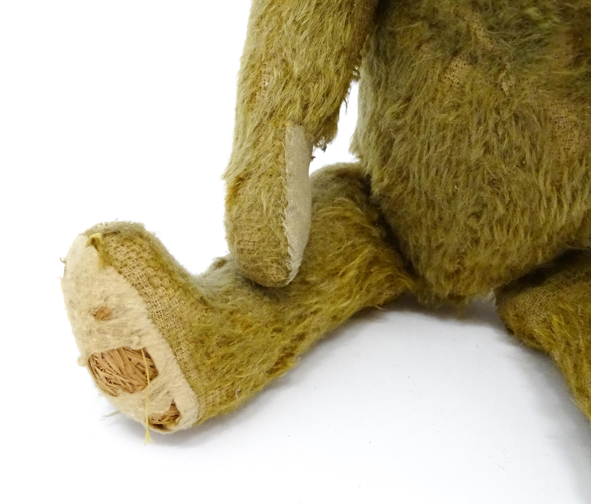 Toy: An early 20thC mohair straw filled teddy bear with proud nose, stitched mouth, hump back, - Image 9 of 9