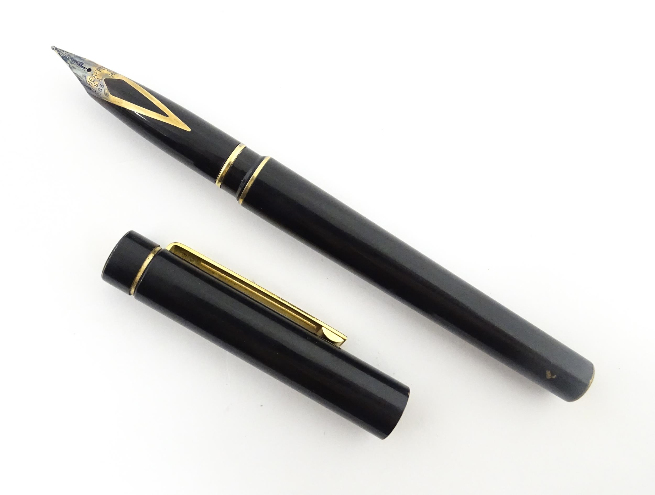 A Schaeffer 'Targa' fountain pen, with black barrel and cap, 14k gold nib, approx 5 3/8" long Please