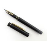 A Schaeffer 'Targa' fountain pen, with black barrel and cap, 14k gold nib, approx 5 3/8" long Please