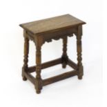 A 19thC walnut join stool of peg jointed construction, with a rectangular top above a moulded