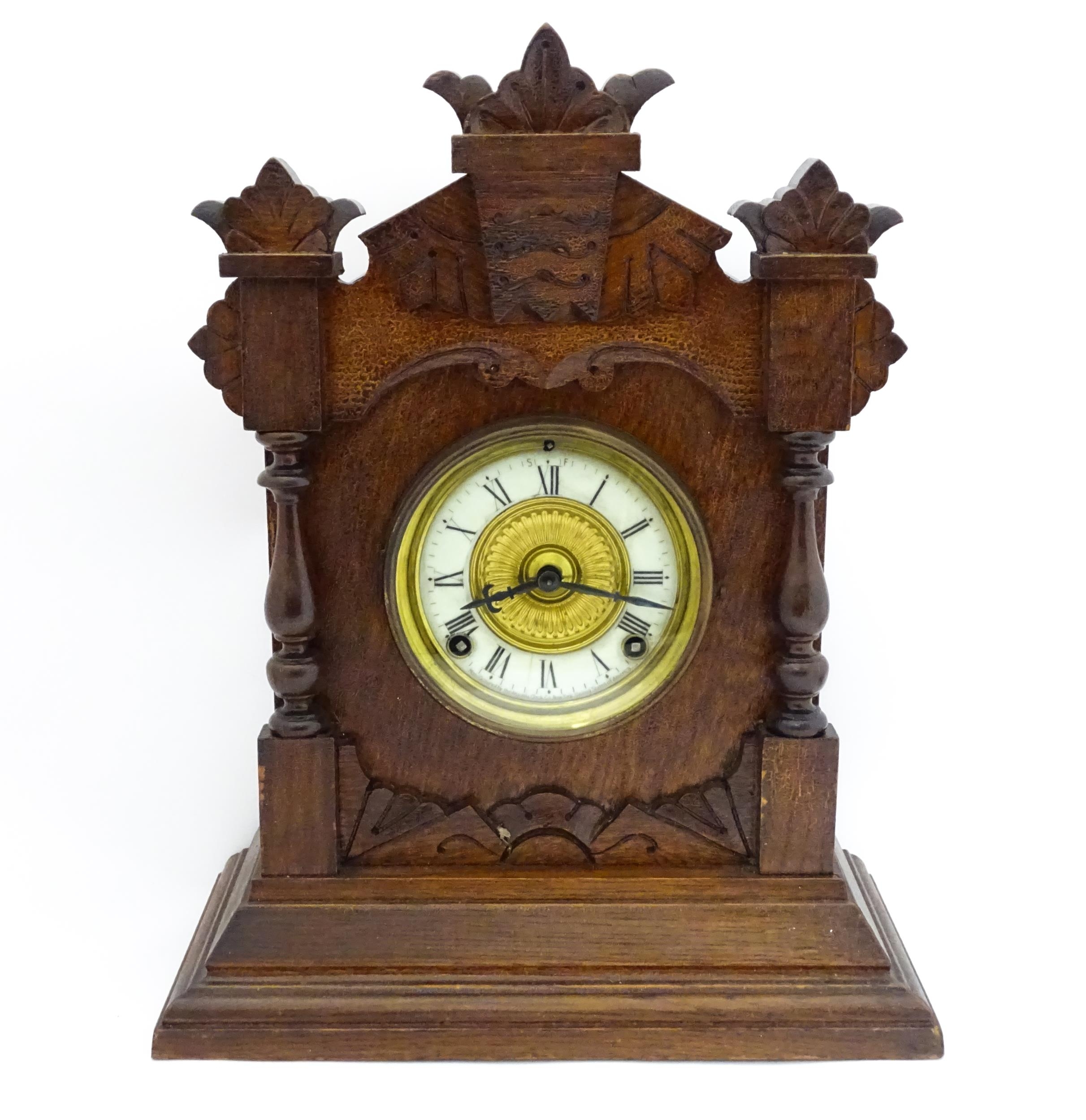 A Late 19thC / Early 20thC American oak cased mantle clock by the Ansonia Clock Company - New