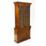 A Victorian mahogany chiffonier bookcase, the top having a moulded cornice above glazed doors