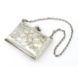 A silver coin purse on chain with engraving scrolling foliate decoration, hallmarked Birmingham