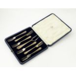 A cased set of six silver pastry forks and server hallmarked Sheffield 1932, maker Mappin & Webb.