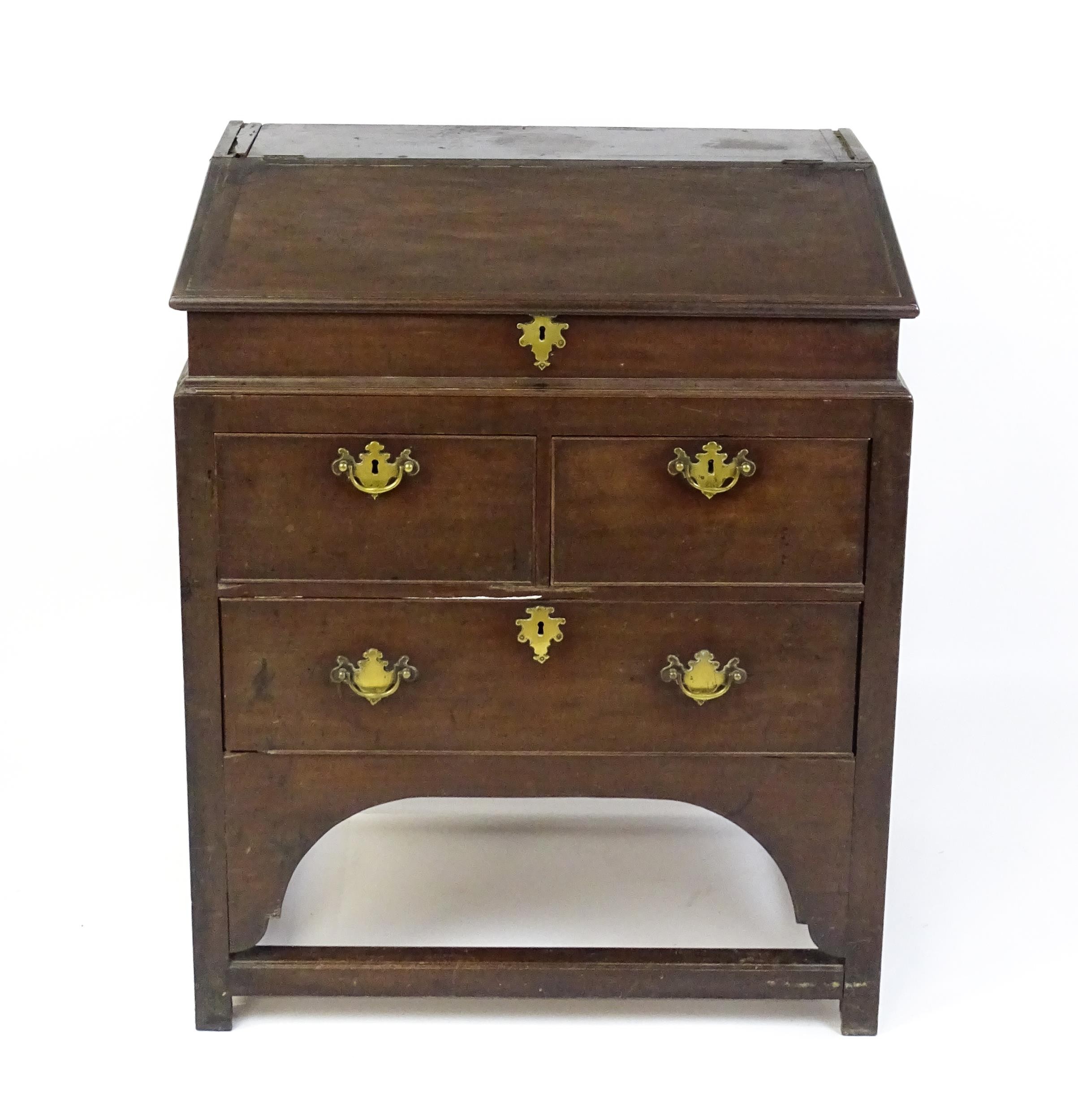 An early / mid 18thC mahogany clerks desk with a hinged sloping lid opening to show a fitted - Image 6 of 8