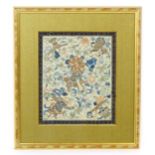 A Chinese needlework embroidery depicting flowers and foliage, within a banded border. The reverse