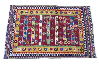 Carpet / Rug : A South West Persian qashgai kilim rug with banded geometric motifs and borders.