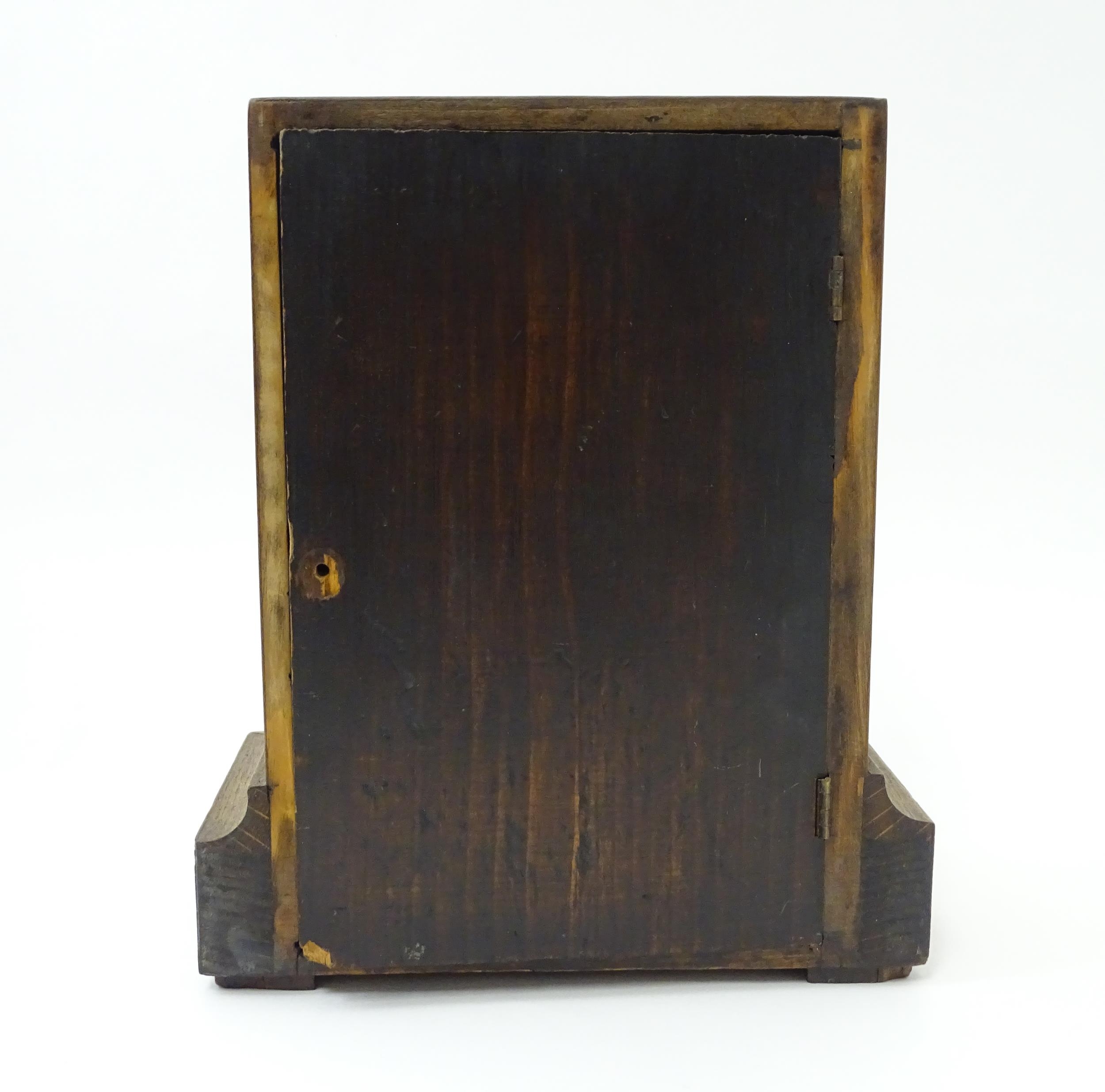 A 20thC oak cased mantle clock bearing label for Camerer, Kuss & Co. Approx. 9 1/4" high Please Note - Image 7 of 13