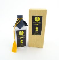 A cased 720ml ceramic flask of Japanese Wakatsuru Shuzo 20 year old 'Sun Shine' Japanese single malt