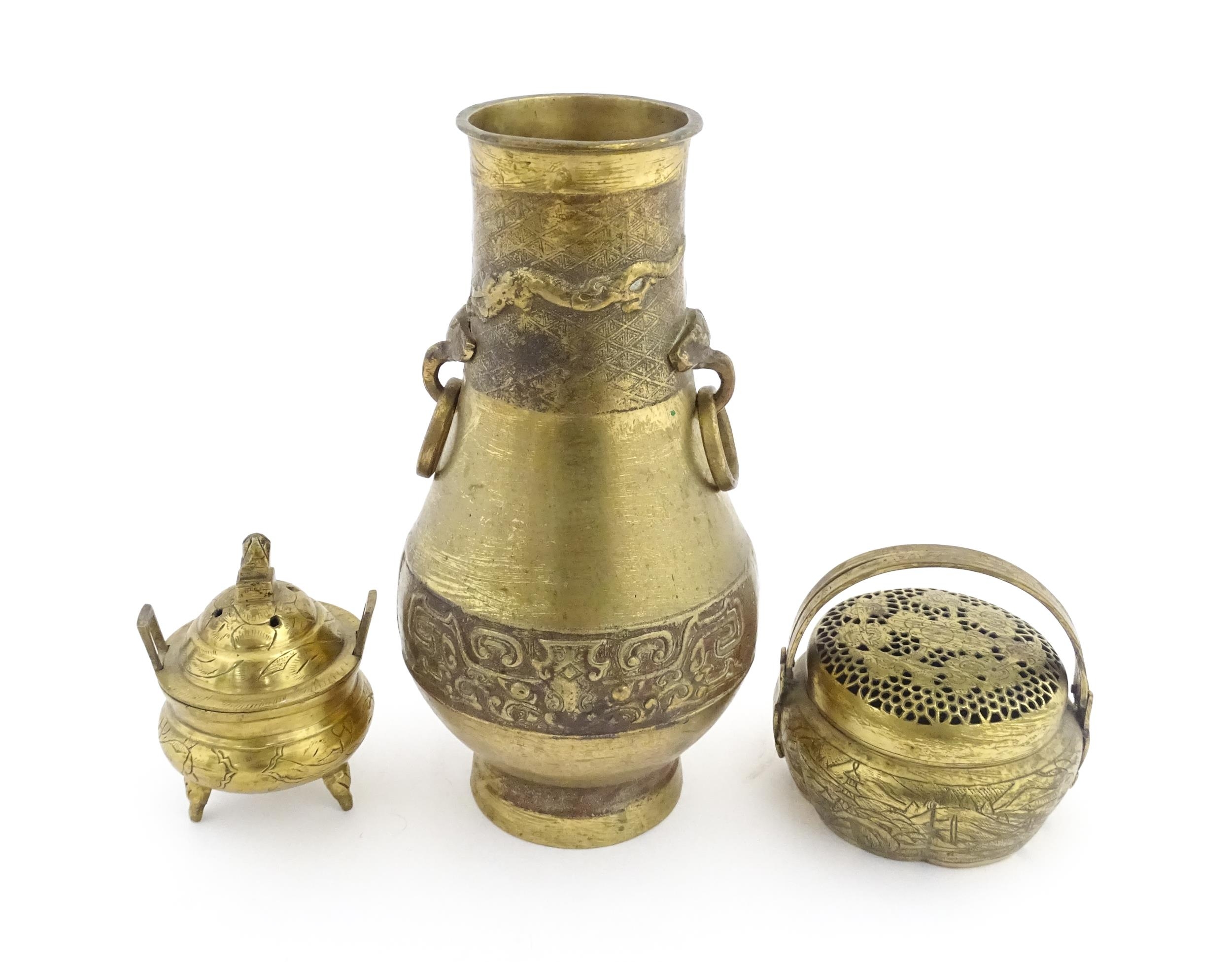 Three items of Chinese brass ware to include a baluster vase with twin ring handles decorated with - Image 5 of 9