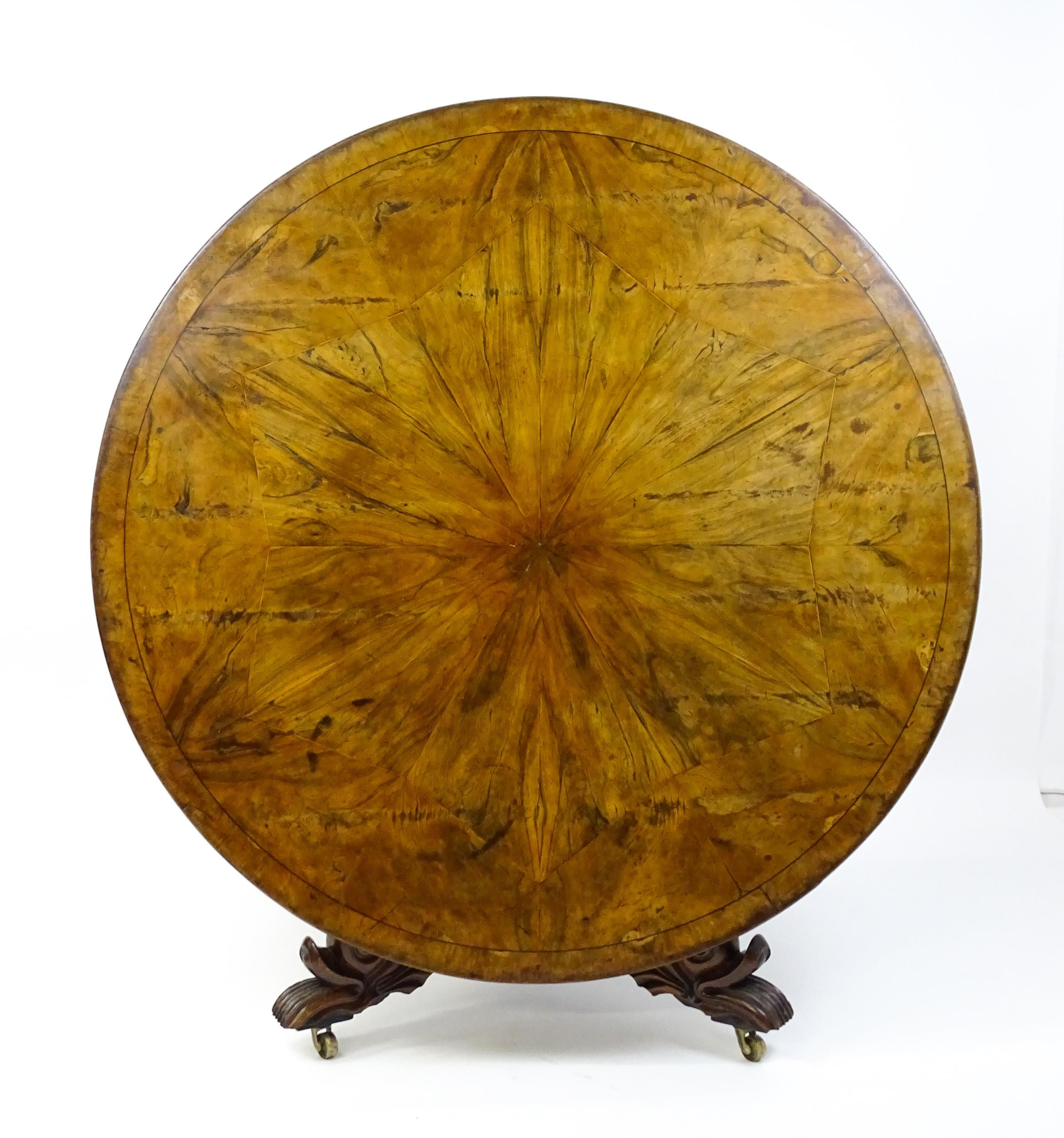 A 19thC dining table with an olive wood veneered circular top raised on a rosewood pedestal with - Image 2 of 15