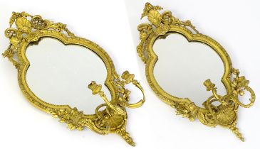 A pair of 19thC giltwood and gesso girandoles with shell motifs, lattice pattern mouldings, fluted