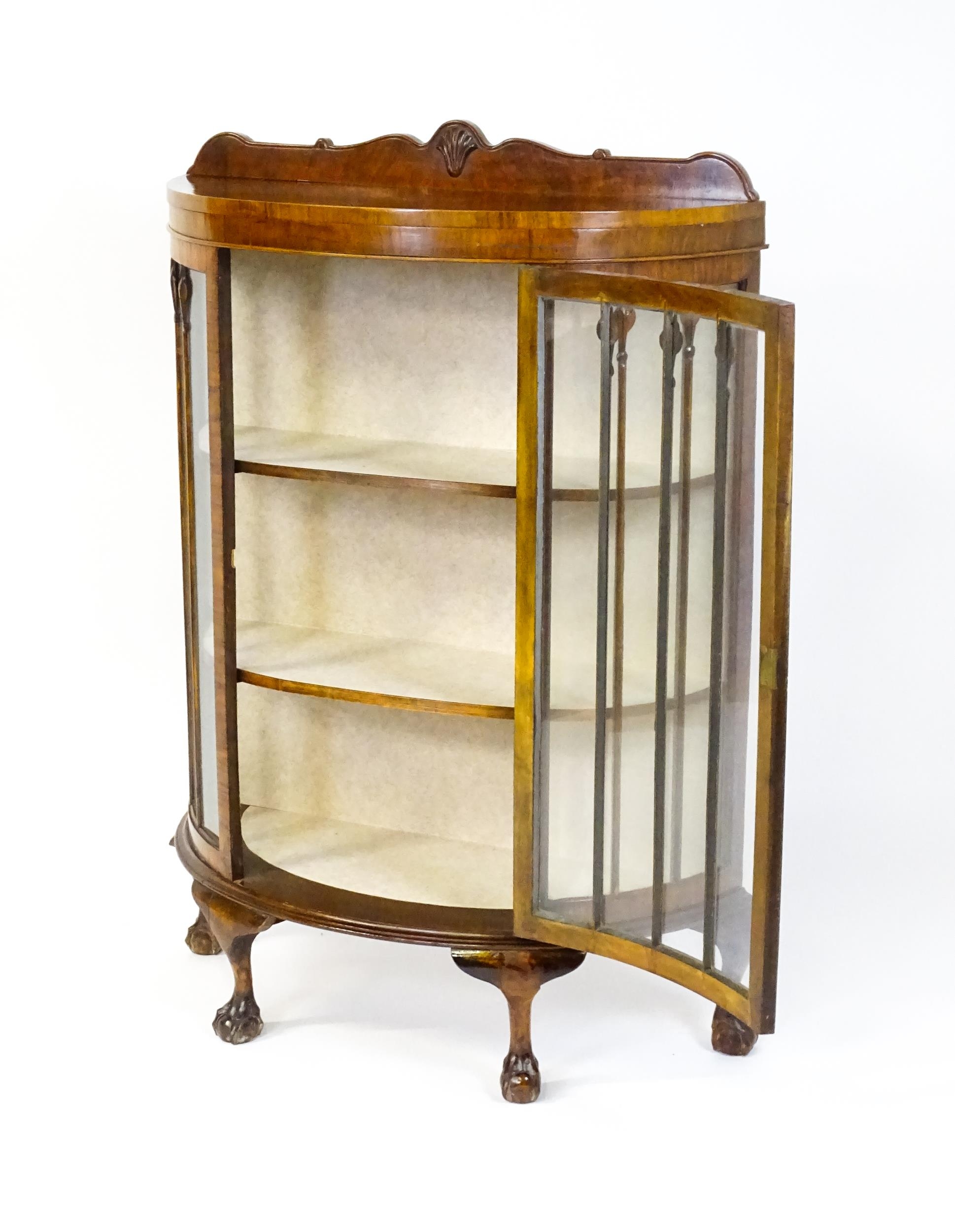 An early / mid 20thC walnut demi lune display cabinet with a shaped and carved upstand above a - Image 3 of 8