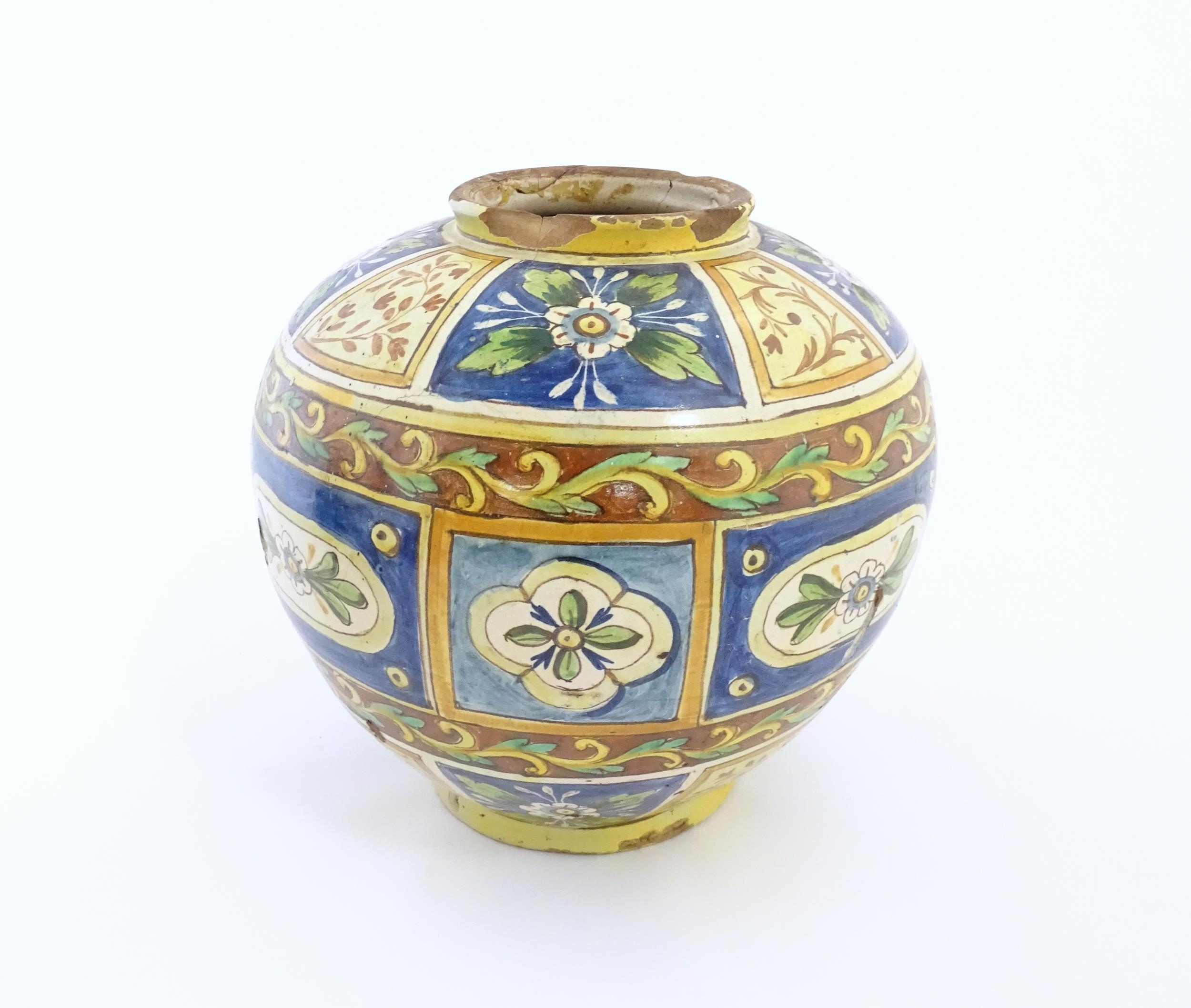 A Sicilian maiolica Bombola vase with panelled and banded decoration depicting flowers and - Image 8 of 10
