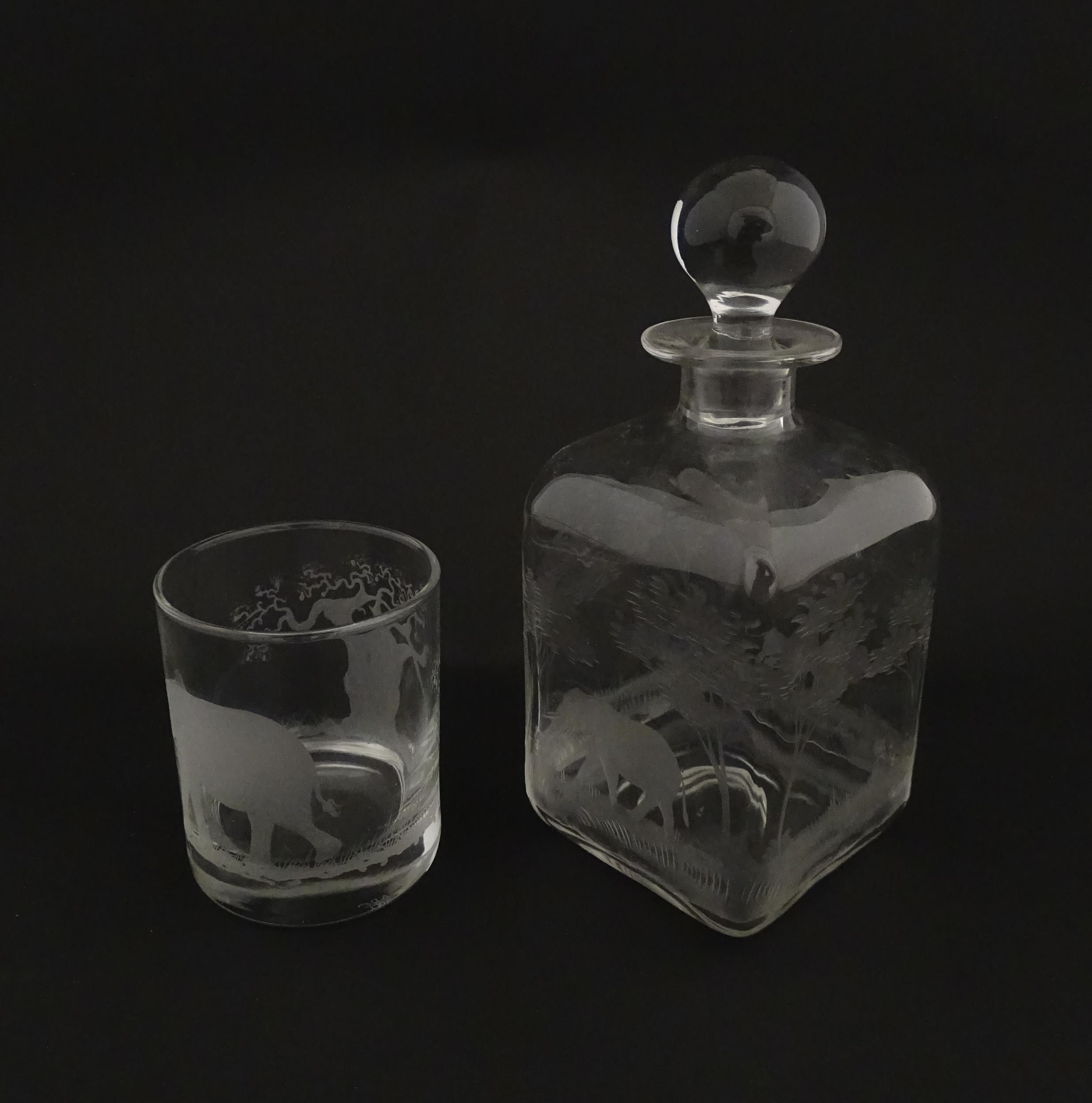 A Rowland Ward decanter glass with engraved Safari animal detail. Unsigned. Together with a similar - Image 5 of 11