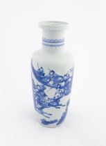 A Chinese blue and white vase decorated with warriors and horses in a landscape. Character marks