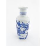 A Chinese blue and white vase decorated with warriors and horses in a landscape. Character marks