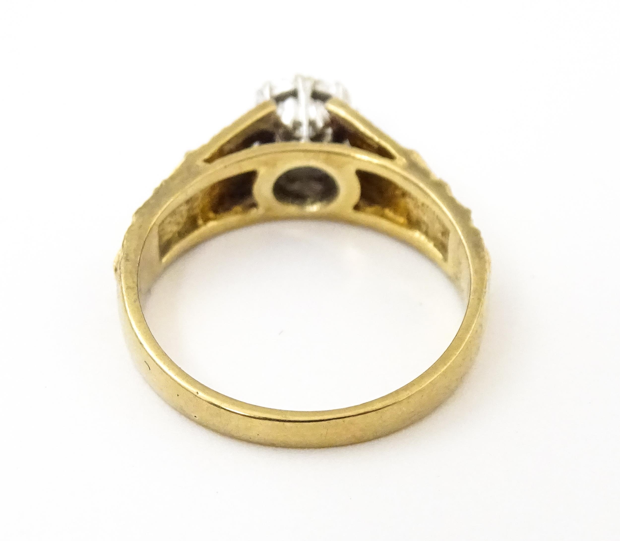 A 9ct gold ring set with central illusion set diamond with star detail to shoulders. Ring size - Image 6 of 7
