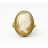 A 9ct gold ring set with classical cameo, the cameo approx 3/4" long Ring size approx. O Please Note