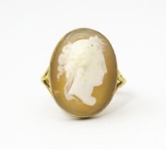 A 9ct gold ring set with classical cameo, the cameo approx 3/4" long Ring size approx. O Please Note