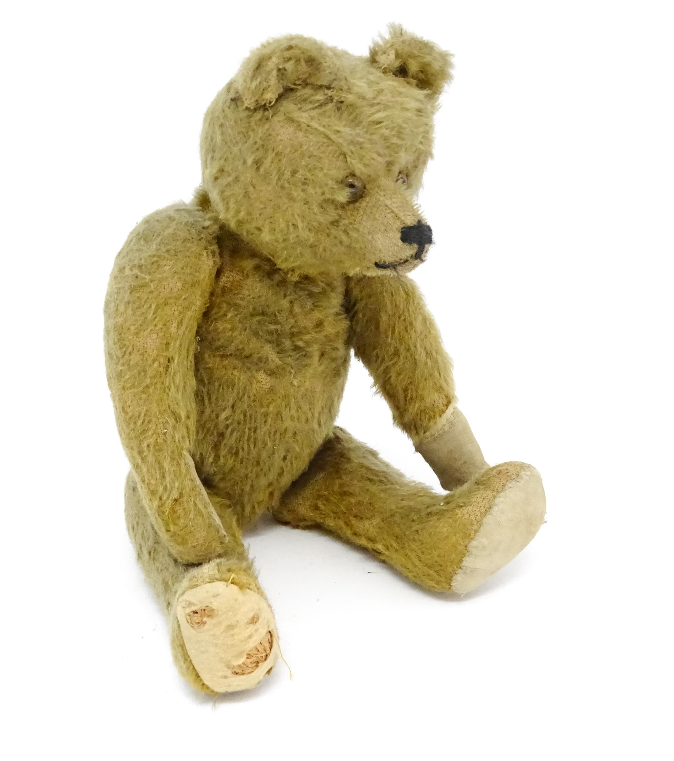 Toy: An early 20thC mohair straw filled teddy bear with proud nose, stitched mouth, hump back, - Image 6 of 9