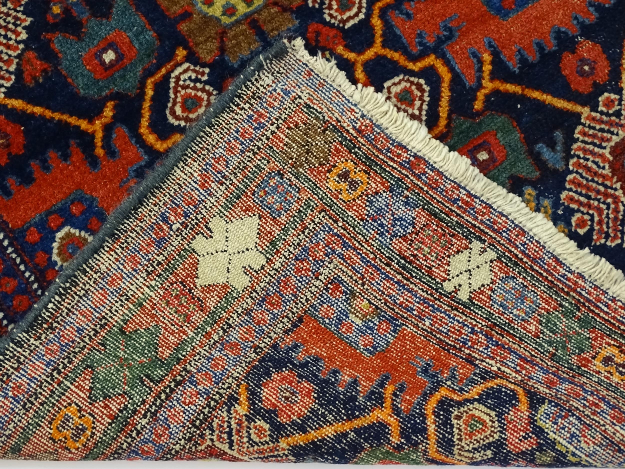 Carpet / Rug: A blue ground rug decorated with repeating geometric motifs of stylised floral and - Image 2 of 8