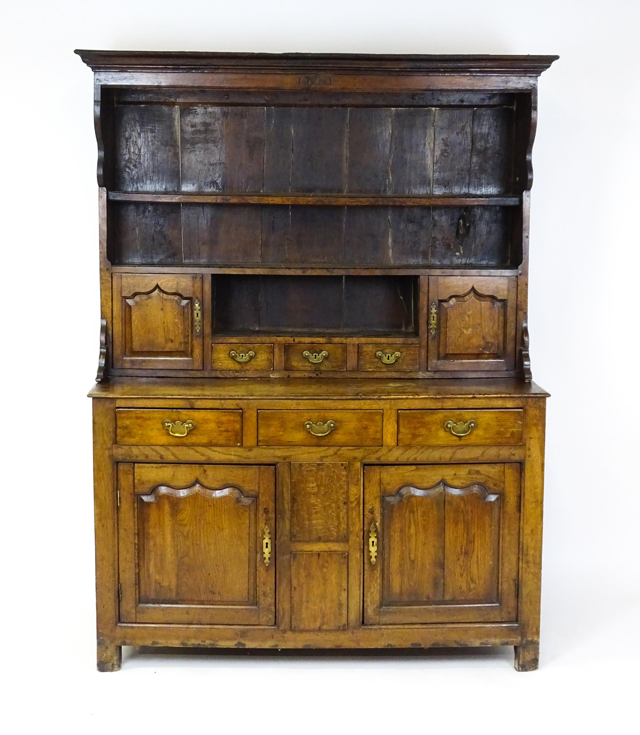 A mid 18thC oak dresser with a moulded cornice above three graduated shelves flanked by panelled - Image 3 of 9