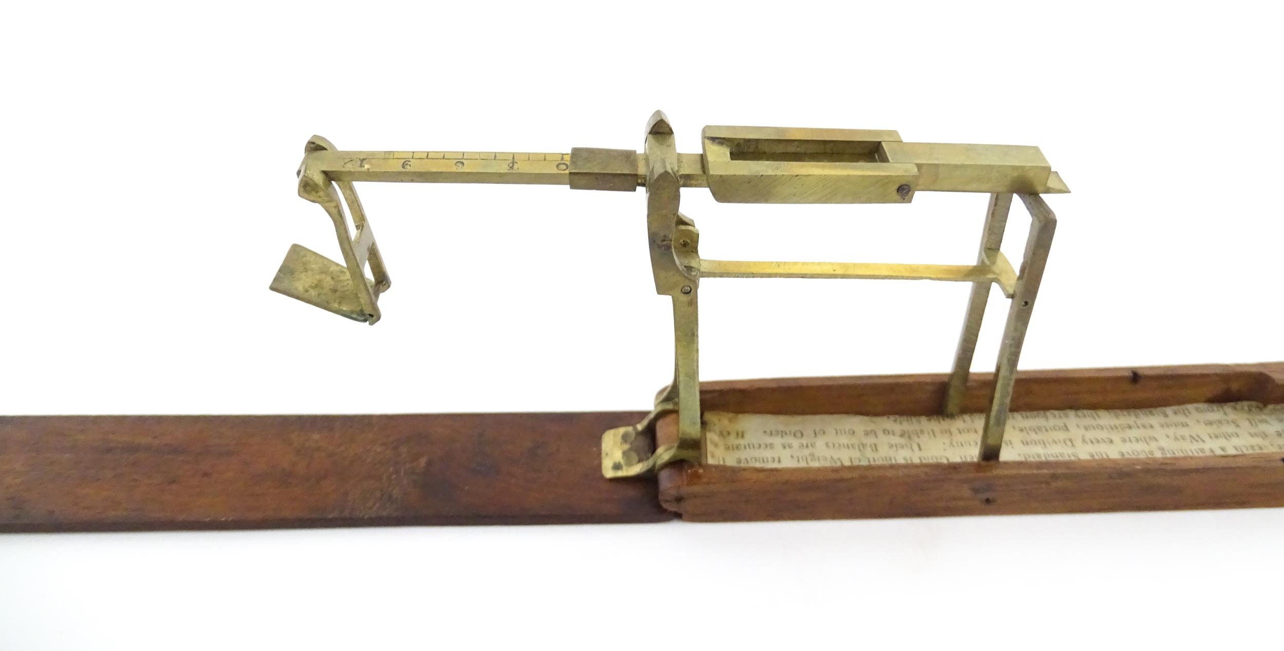 A 19thC mahogany cased brass folding guinea / coin scale. Case approx. 5 1/2" long Please Note - - Image 6 of 11