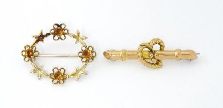Two 9ct gold brooches, one hallmarked Chester 1915, maker Harry & Charles Banks, the other set