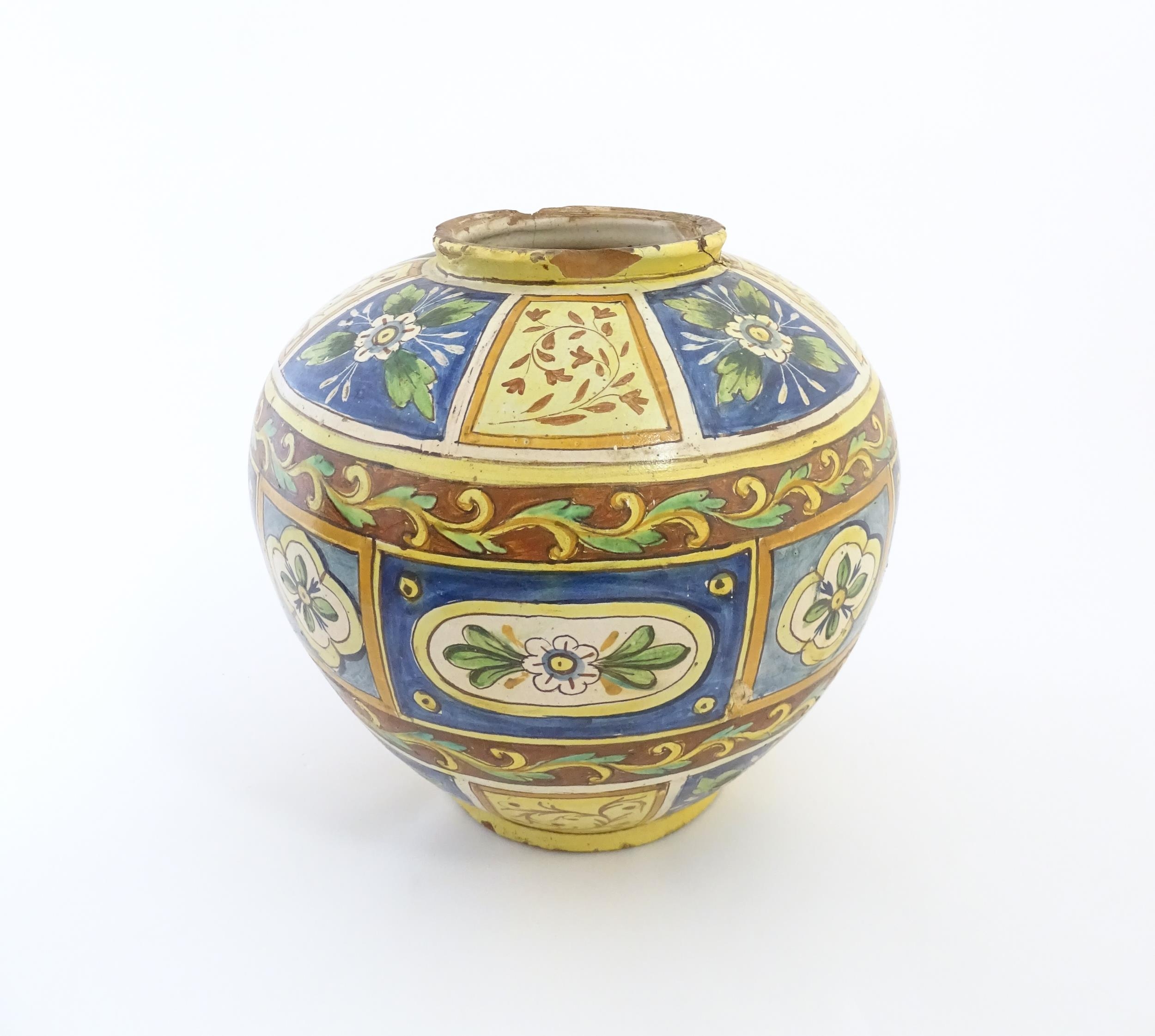 A Sicilian maiolica Bombola vase with panelled and banded decoration depicting flowers and - Image 3 of 10