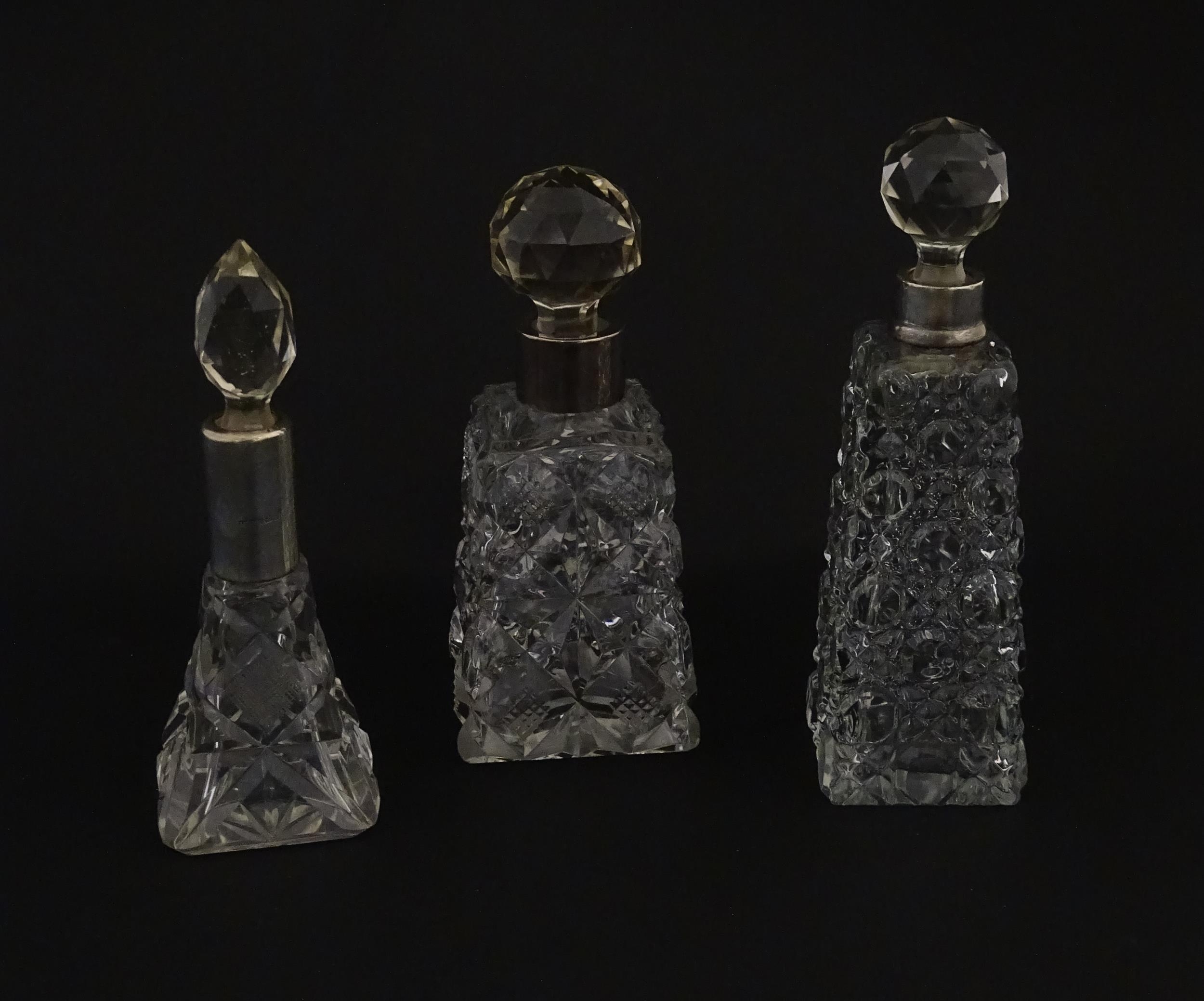 Three assorted cut glass scent / perfume bottles with silver mounts, to include one hallmarked - Image 3 of 10