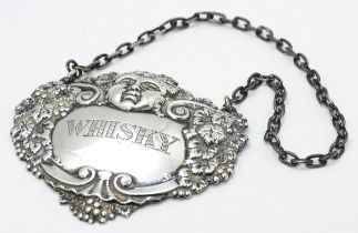 A silver wine / decanter label / bottle ticket for Whisky, hallmarked Birmingham 1968. Approx. 2 1/