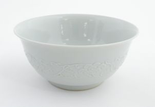 A Chinese bowl with banded foliate decoration to exterior and hand painted peached to interior.