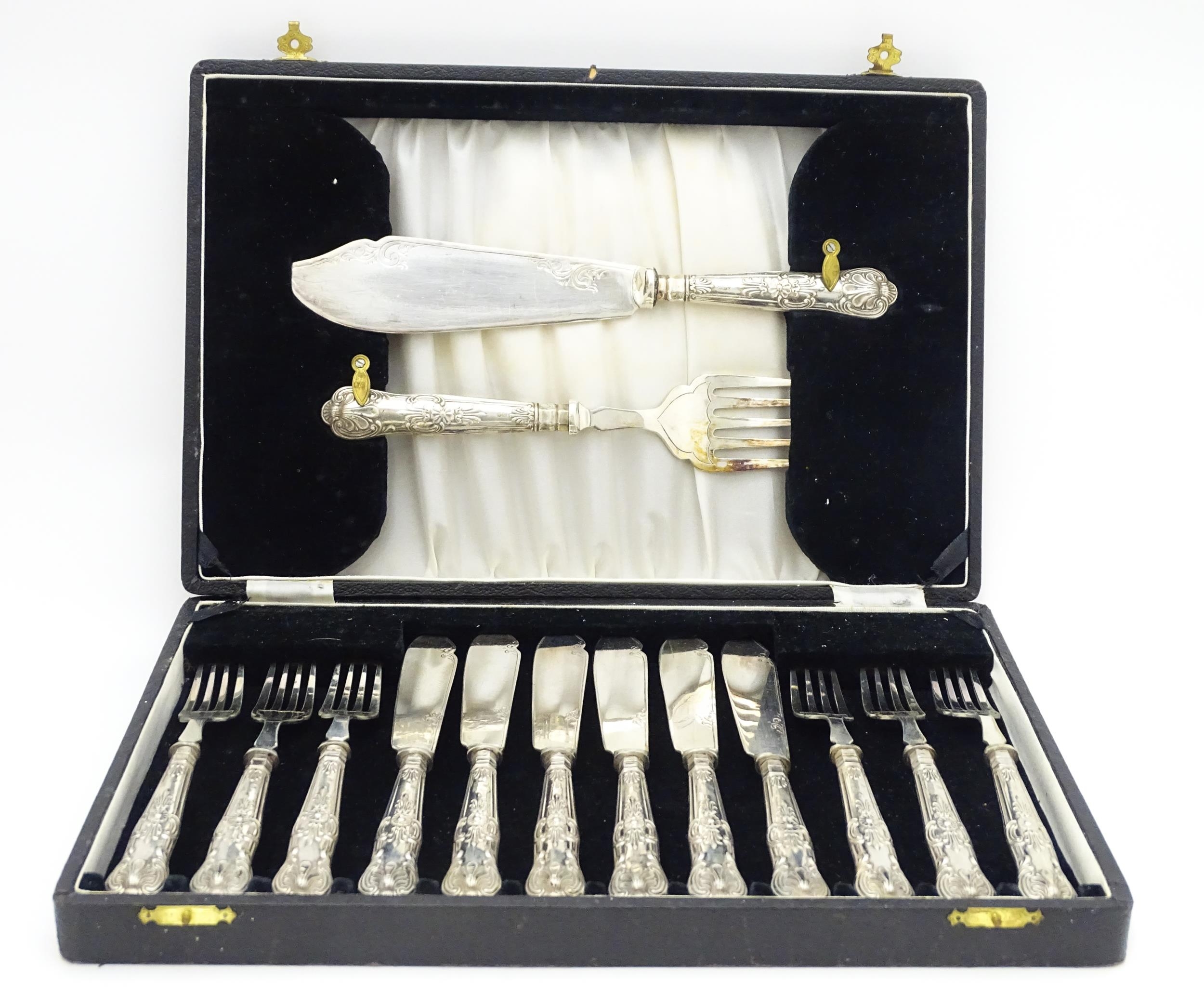 A cased set of six silver handled fish knives and forks with fish servers hallmarked Sheffield 1938,