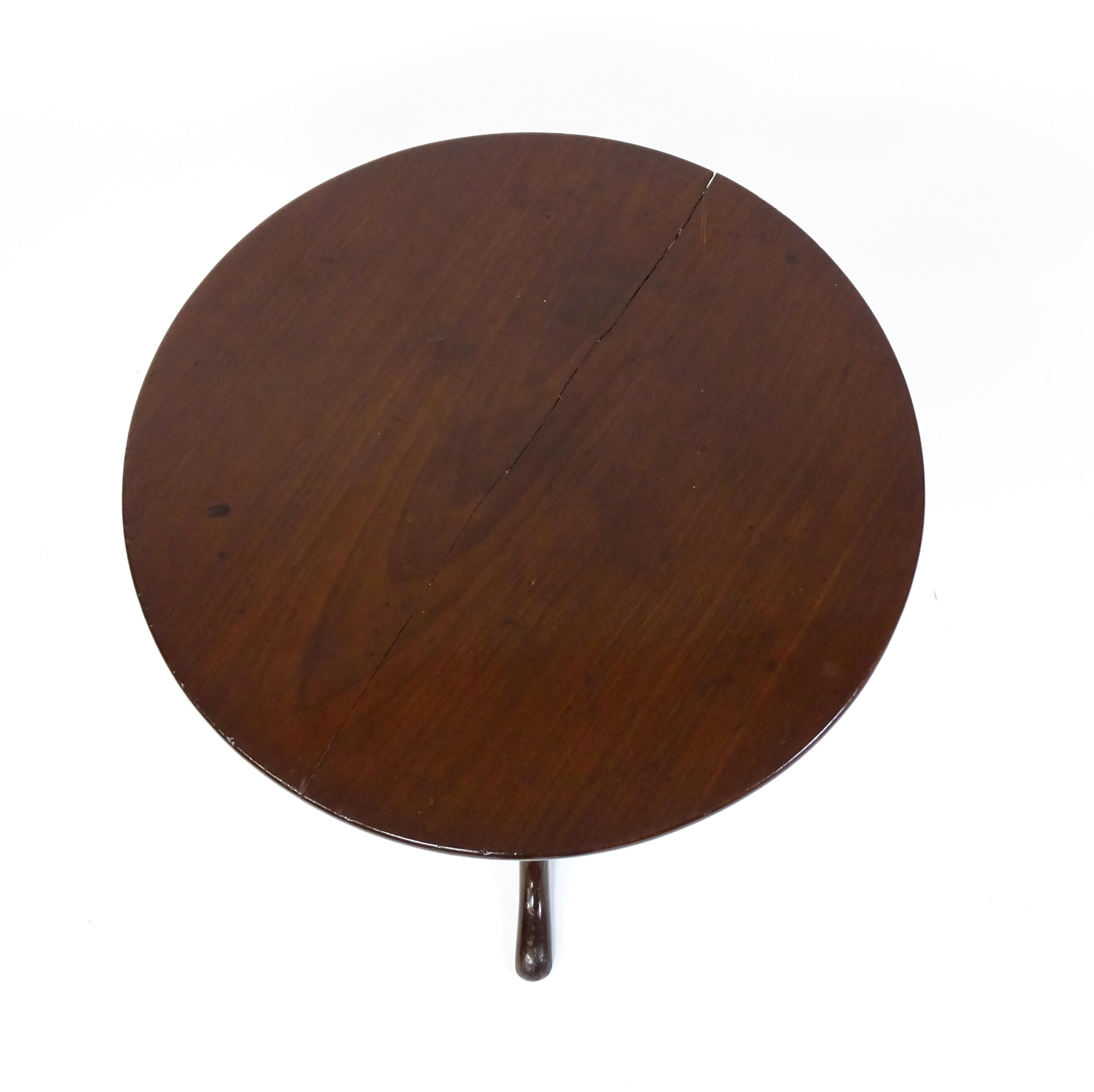 A 19thC mahogany tripod table with a turned pedestal above three cabriole legs. 27" high x 23" in - Image 4 of 5