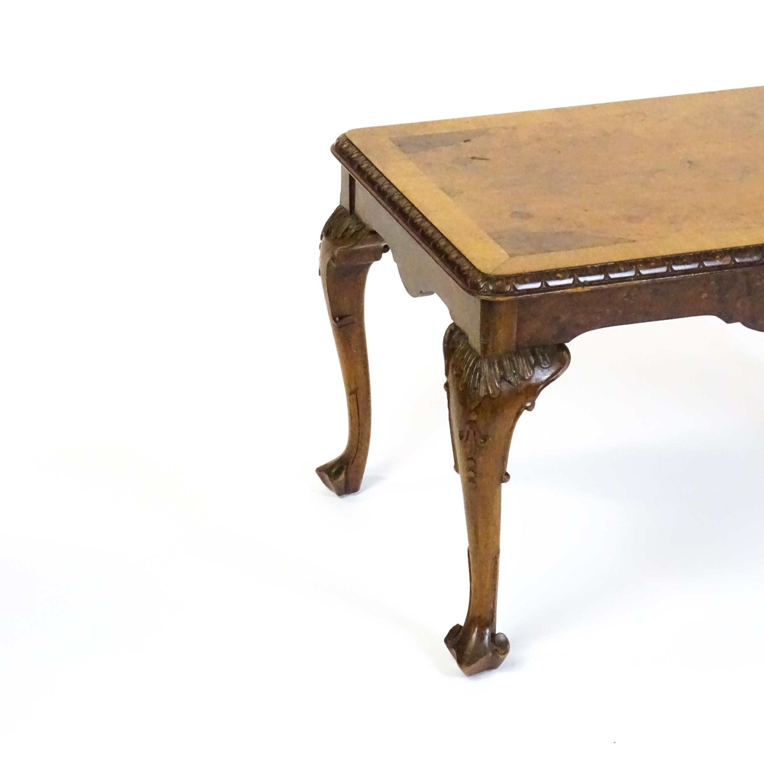 A mid / late 20thC coffee table with a burr walnut veneered top, with an egg and dart moulded edge - Bild 2 aus 8